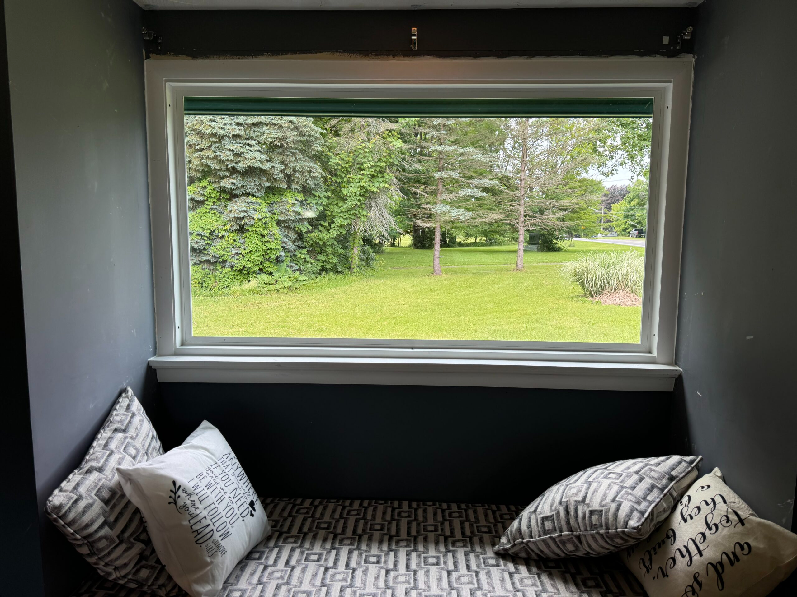 After photo showcasing beautiful, energy-efficient vinyl replacement windows expertly installed on a Cayuga County home by WeBuild CNY