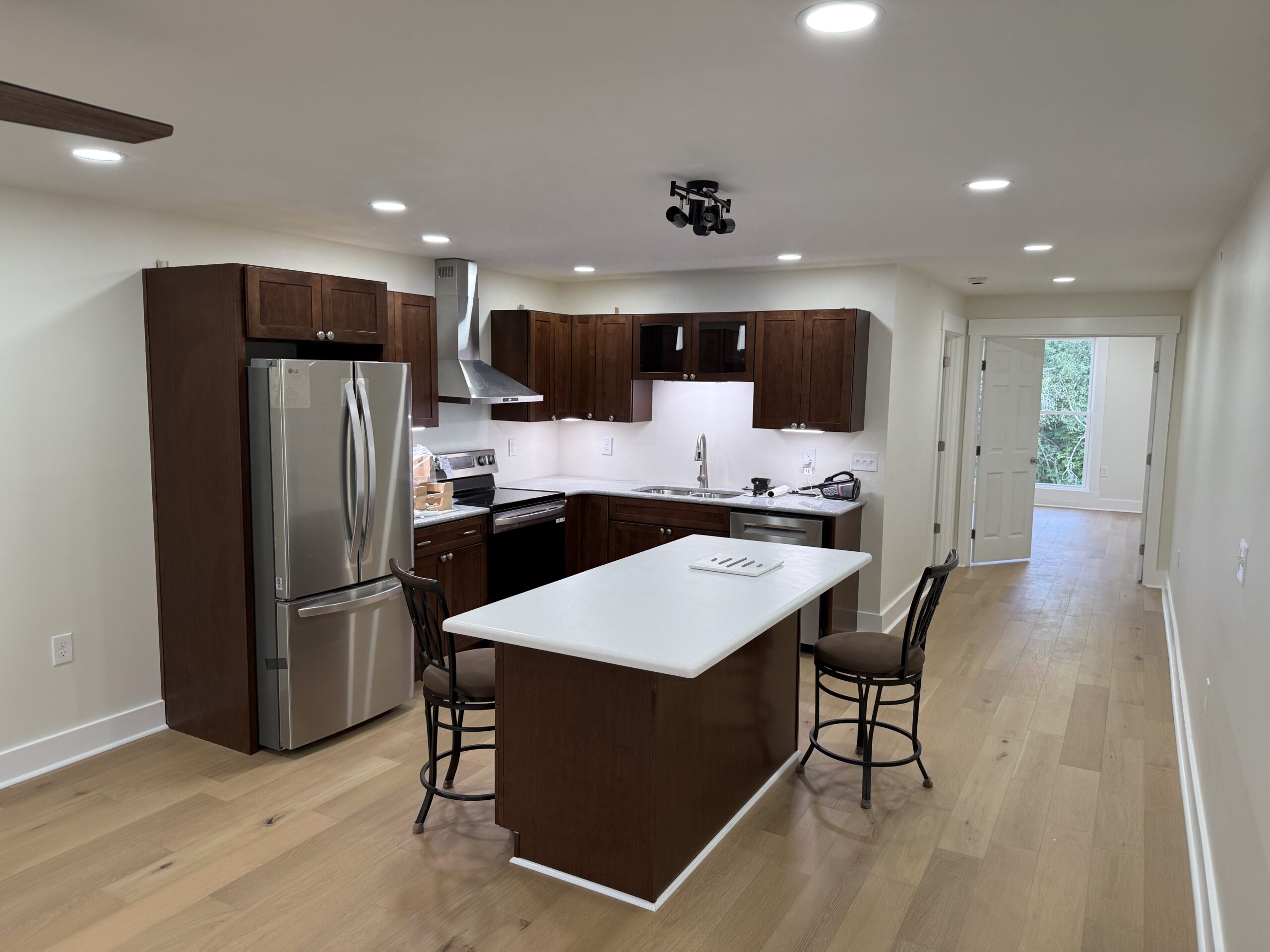 Finished interior living space of an 80x30 pole barn converted into a multi-family barndominium in Aurora, NY