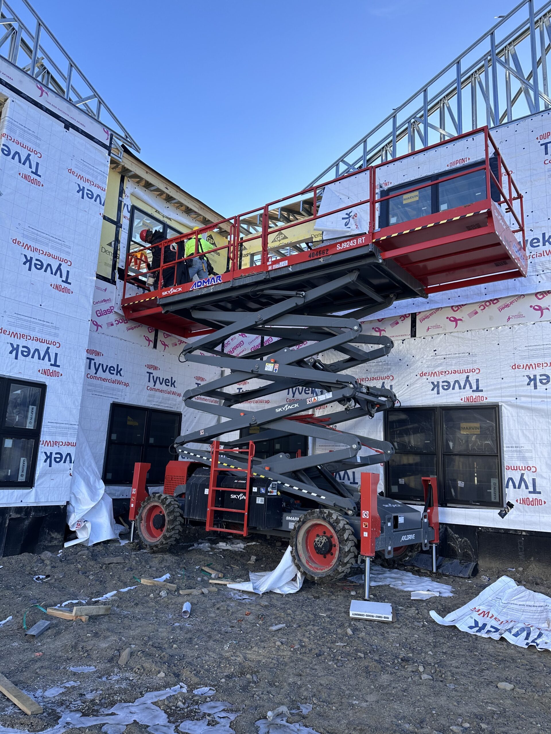 WeBuild CNY commercial window contractors installing custom Marvin windows at a luxury property in Skaneateles, New York