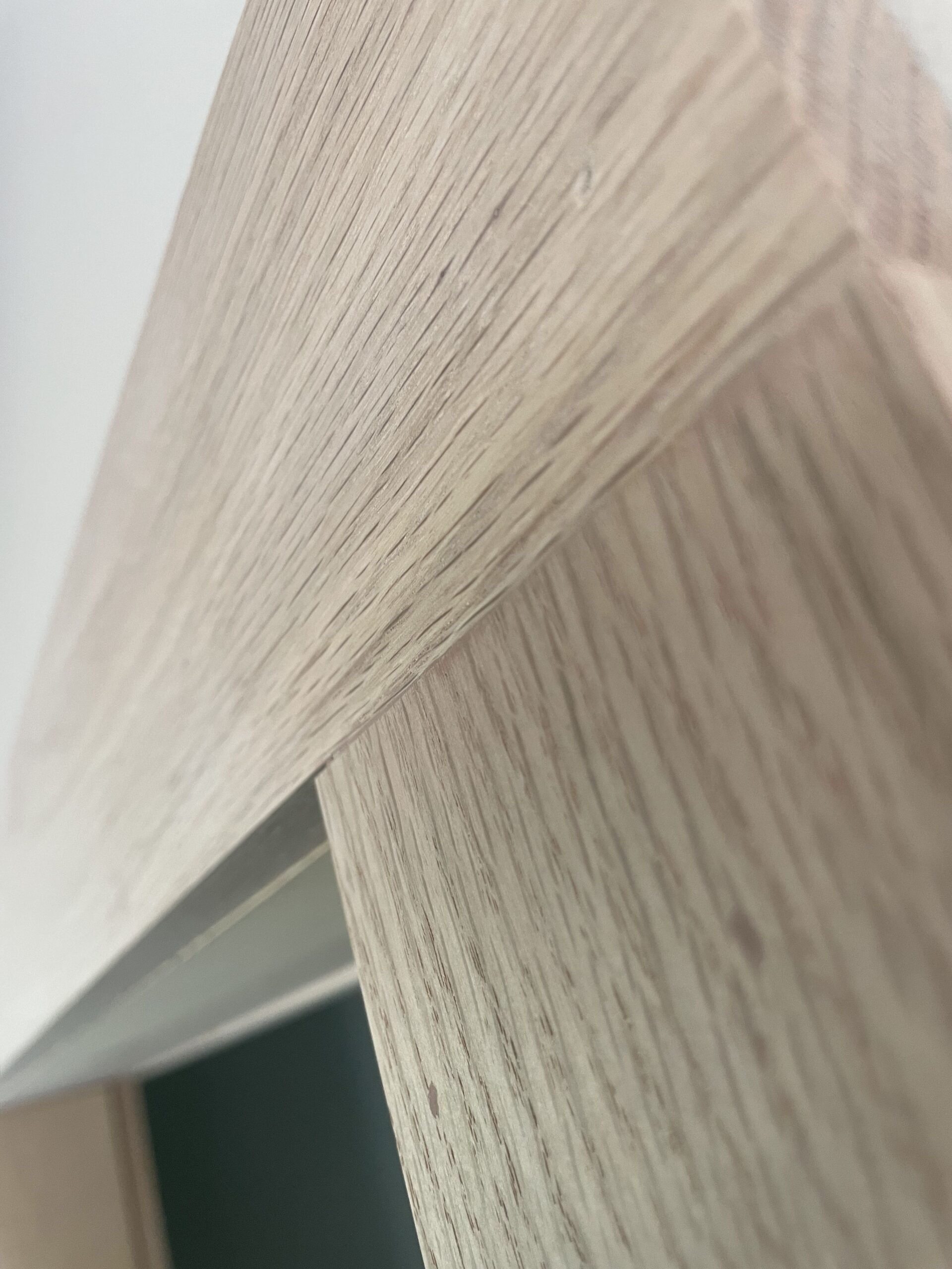 Close-up detail of precision interior trim, baseboards, and finish carpentry in a Cayuga County home renovation