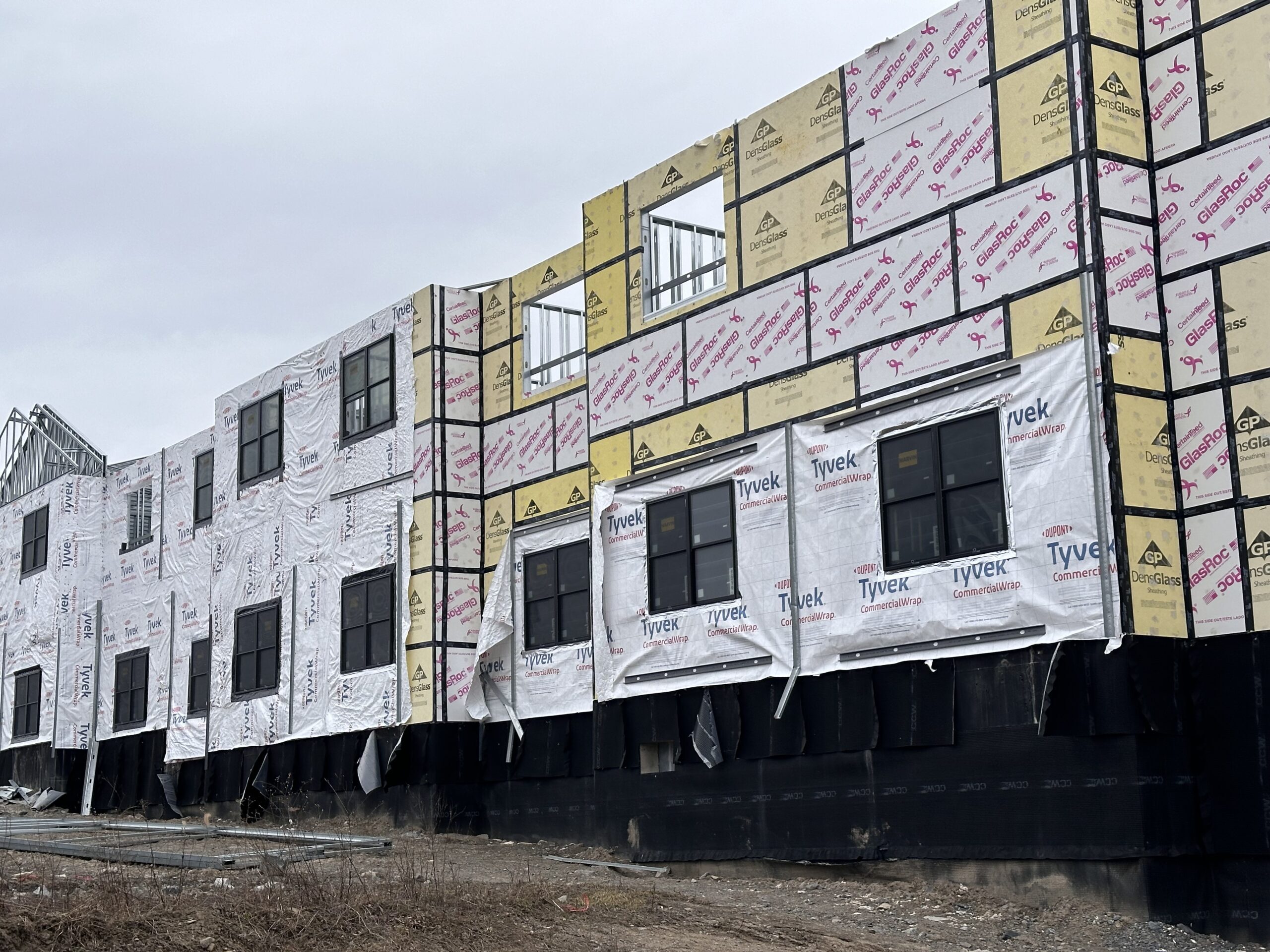 Exterior view of Skaneateles Lodge Curio Collection by Hilton featuring newly installed commercial Marvin windows by WeBuild CNY