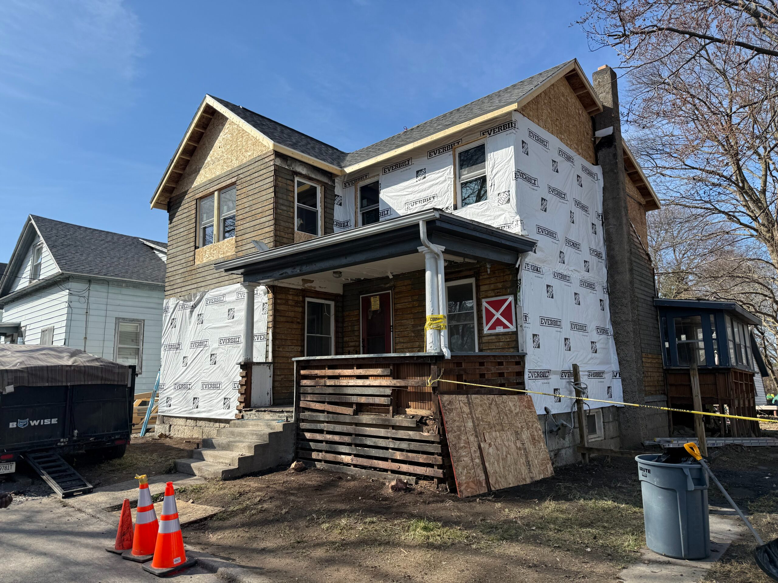 In-progress structural framing and complete home rebuild following severe fire damage in Auburn, New York by local contractors WeBuild CNY