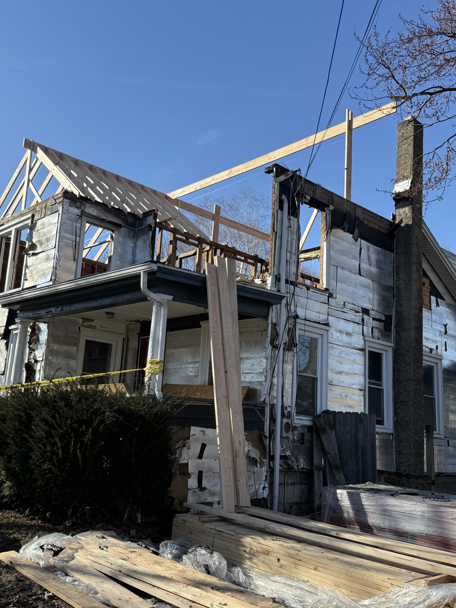 WeBuild CNY contractors performing structural framing repair after a devastating attic fire in Auburn NY
