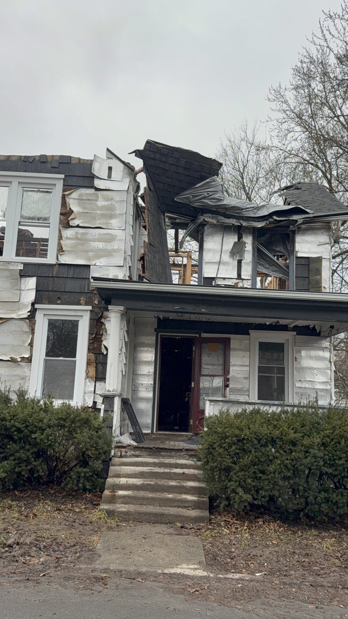 Devastating aftermath of a house fire requiring complete professional restoration and rebuilding services