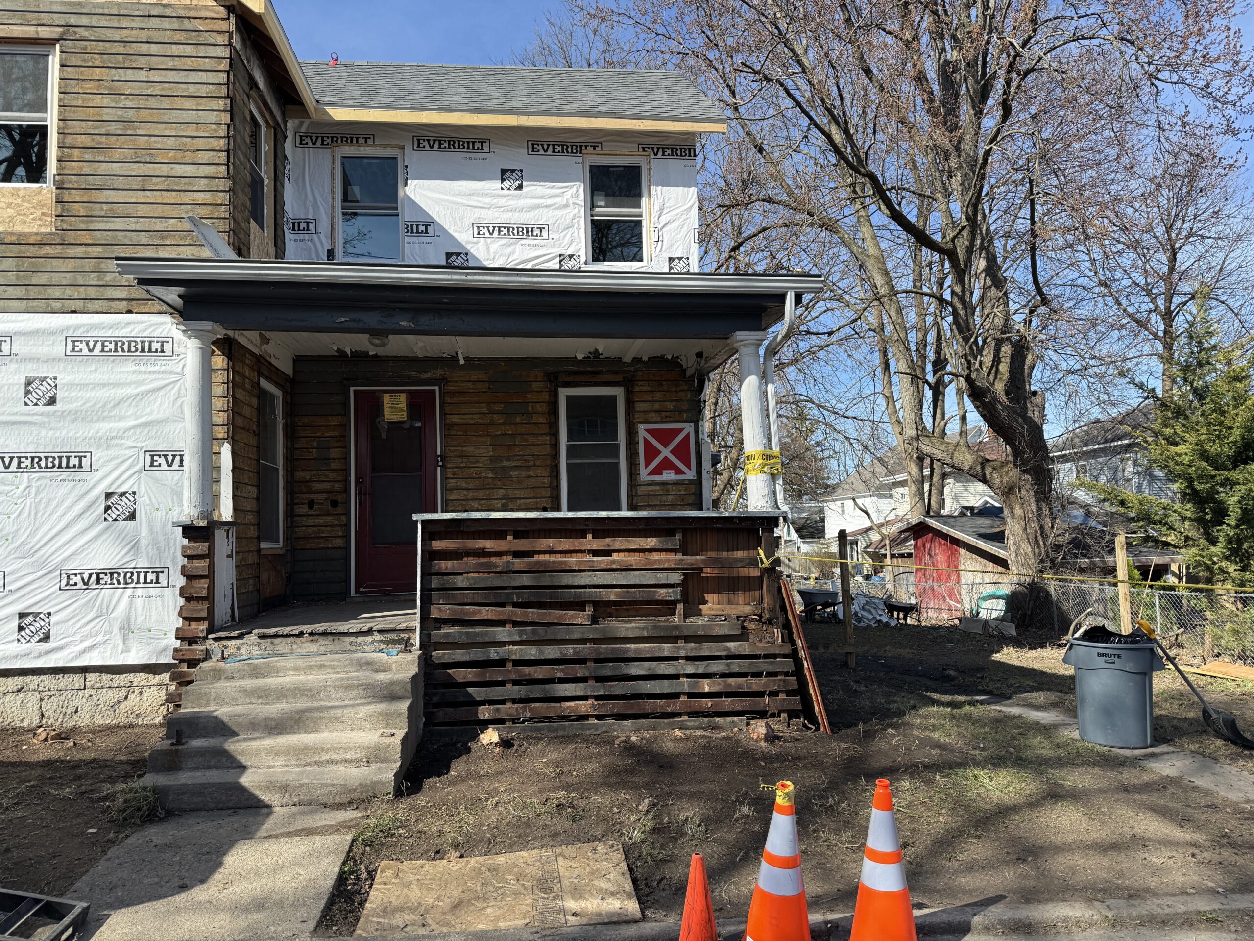 Progress on exterior sheathing and weatherproofing during a major home restoration project
