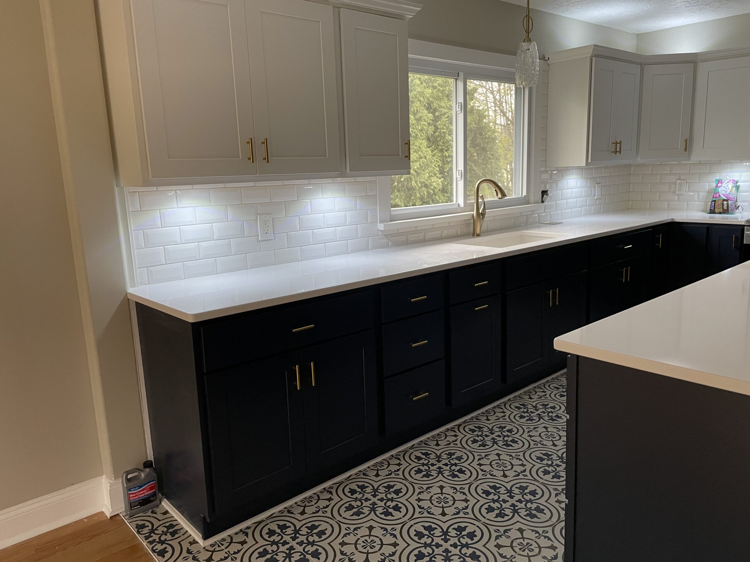 High-end countertops and elegant tile backsplash installed in a Cayuga County home