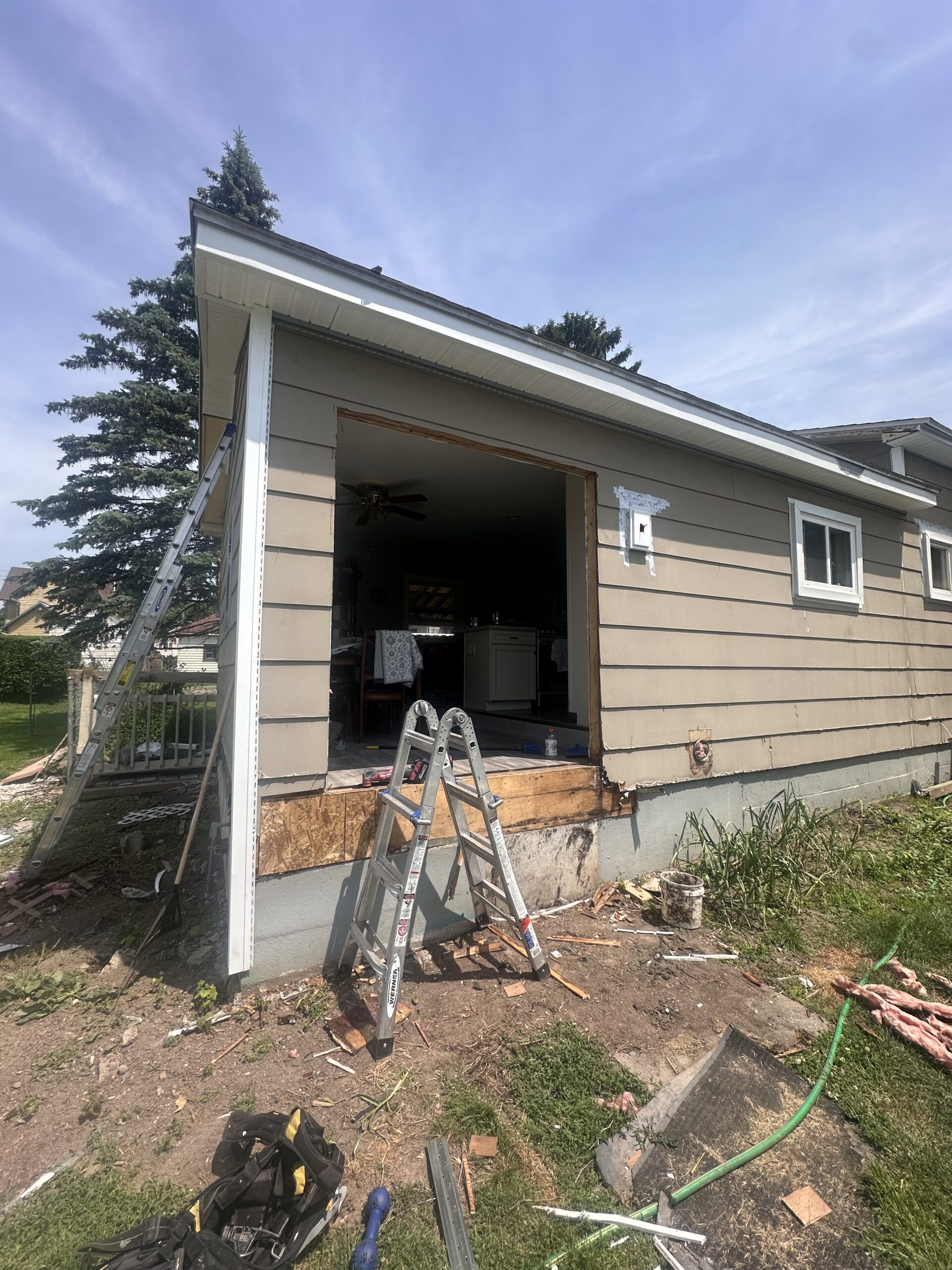Original siding condition on an Auburn NY home requiring a complete exterior remodel