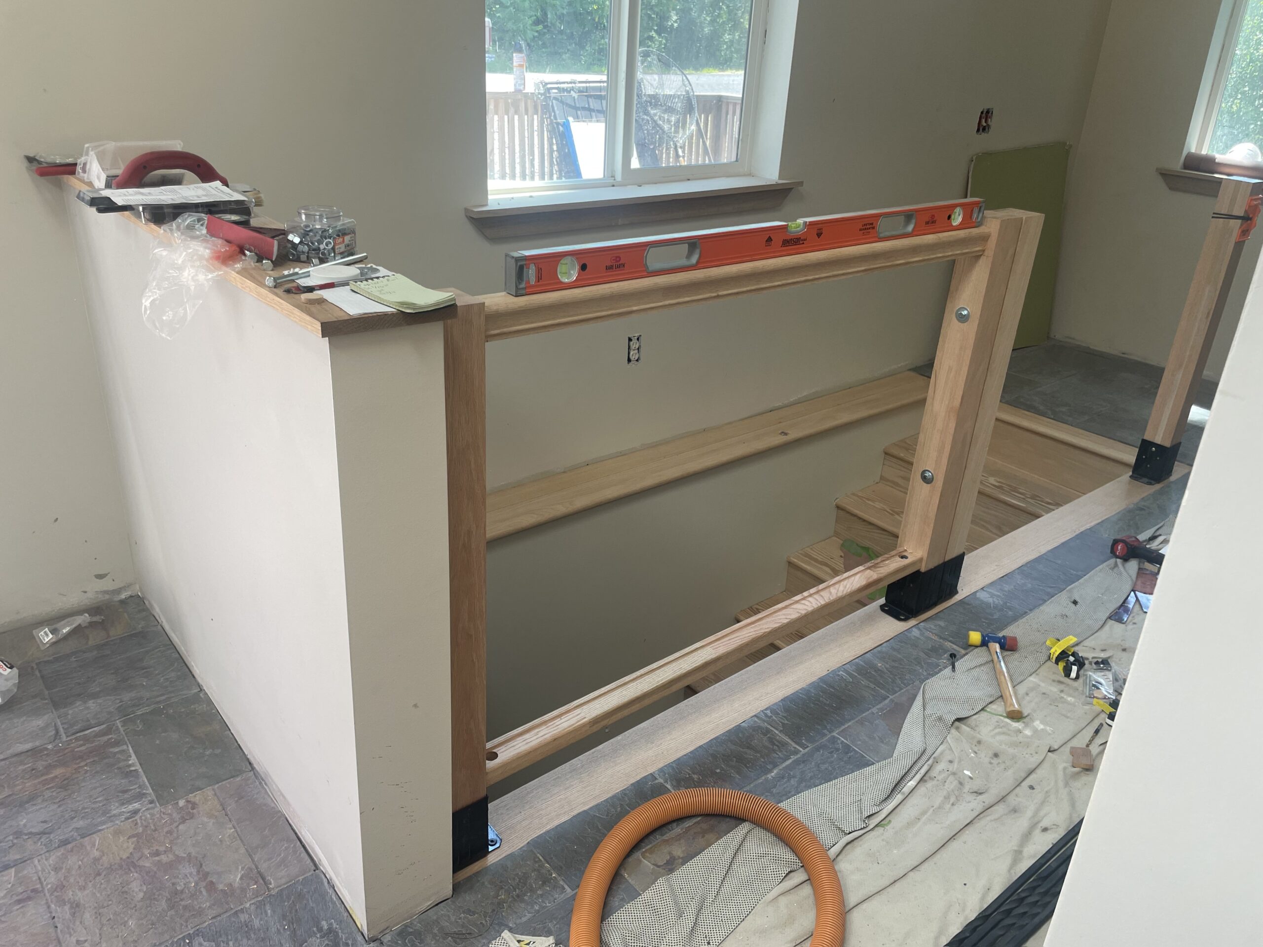 Structural installation of newel posts and handrails by WeBuild CNY carpenters