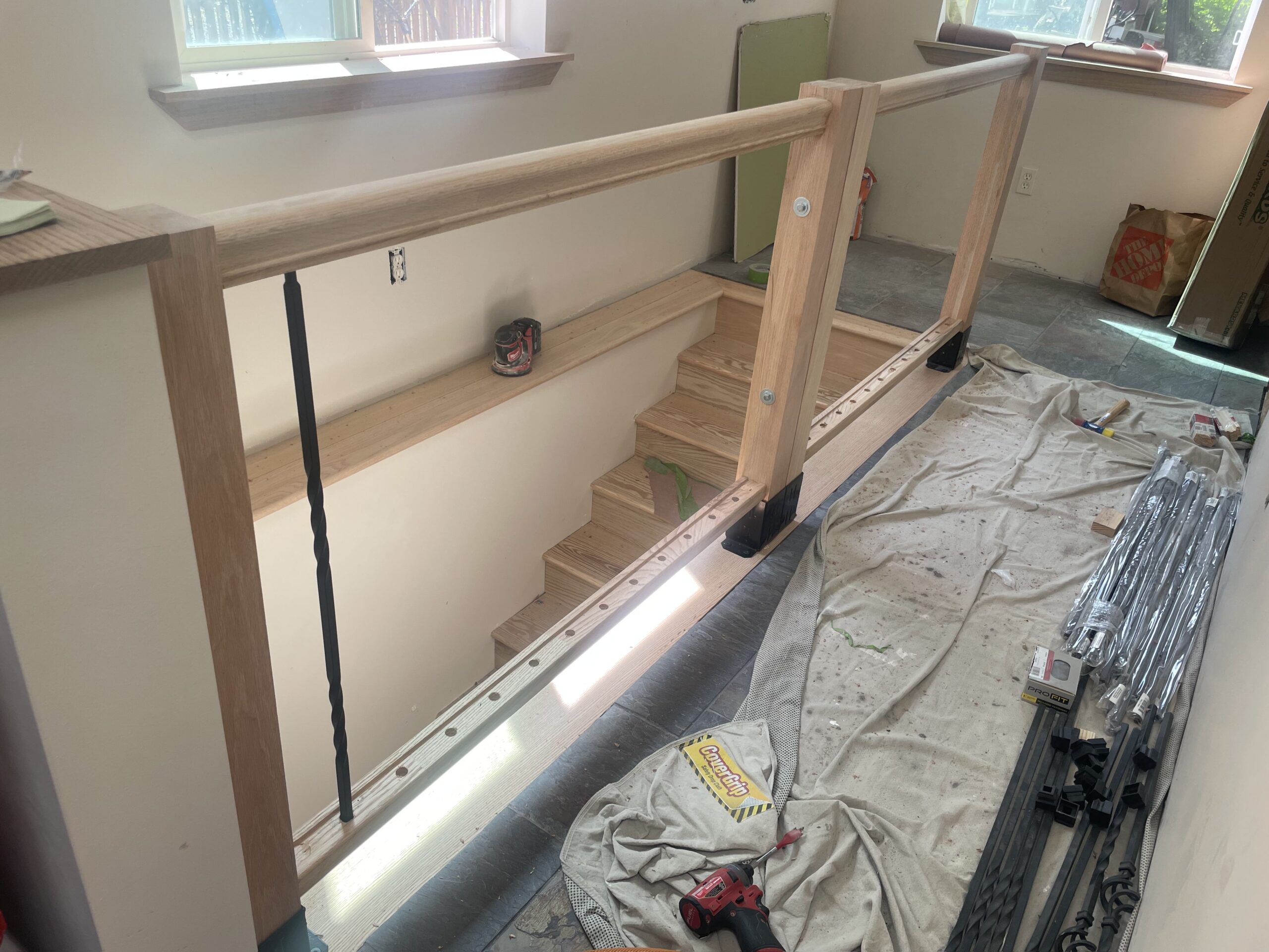 Finish carpentry in progress for a beautiful new residential stair railing system