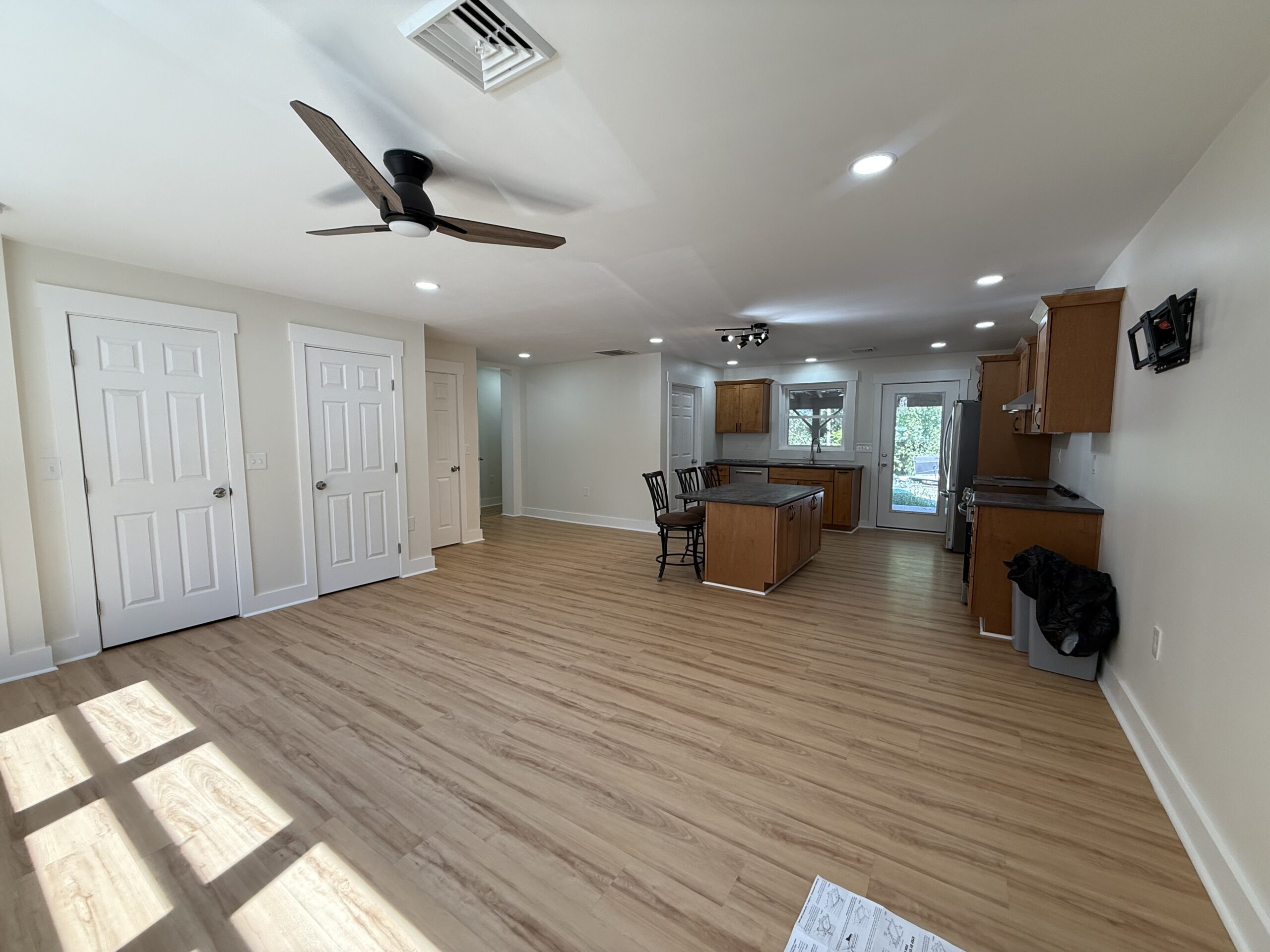 Modern open concept living space inside the newly finished Aurora barndominium