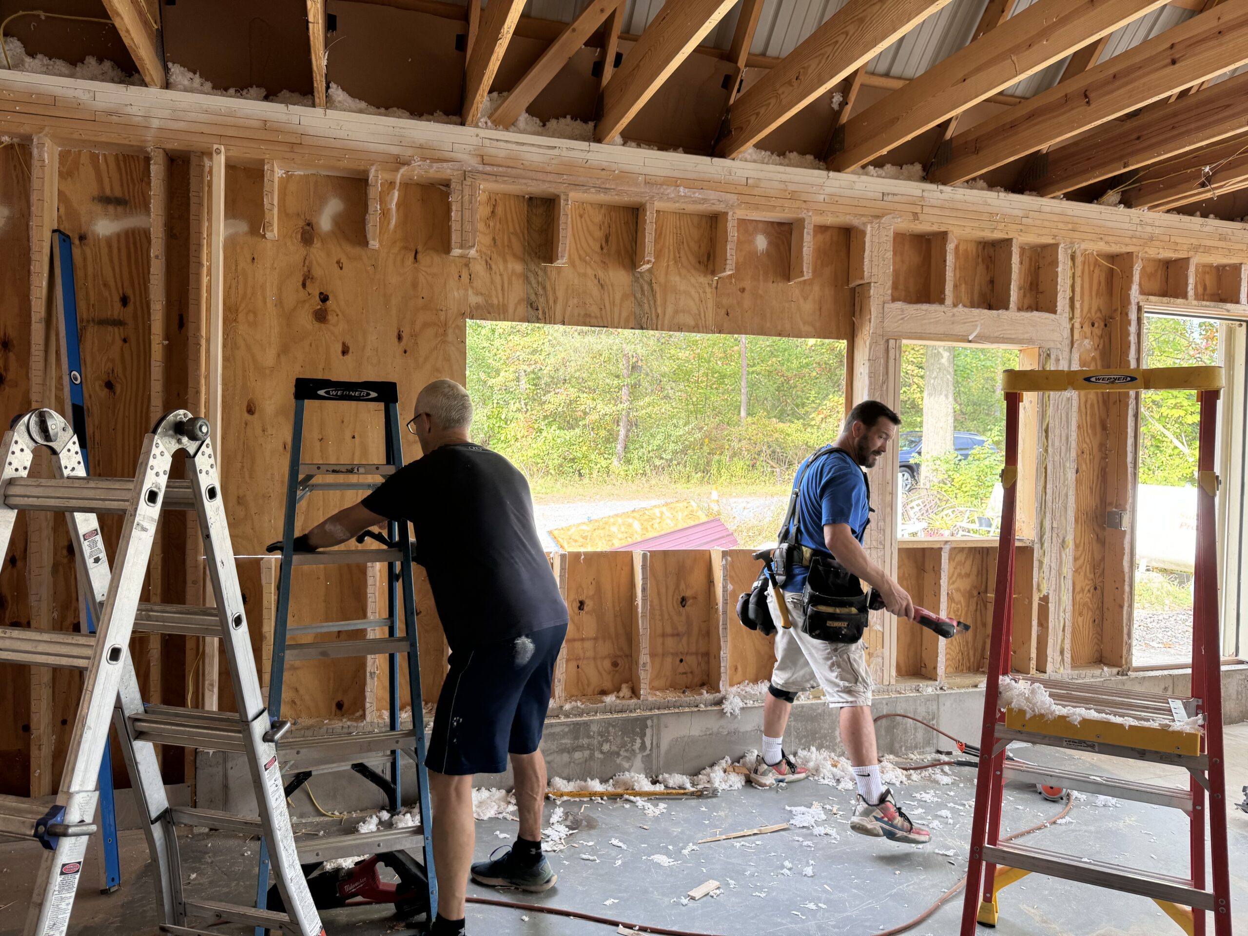 Custom flooring and interior cabinetry being installed in the Aurora remodel