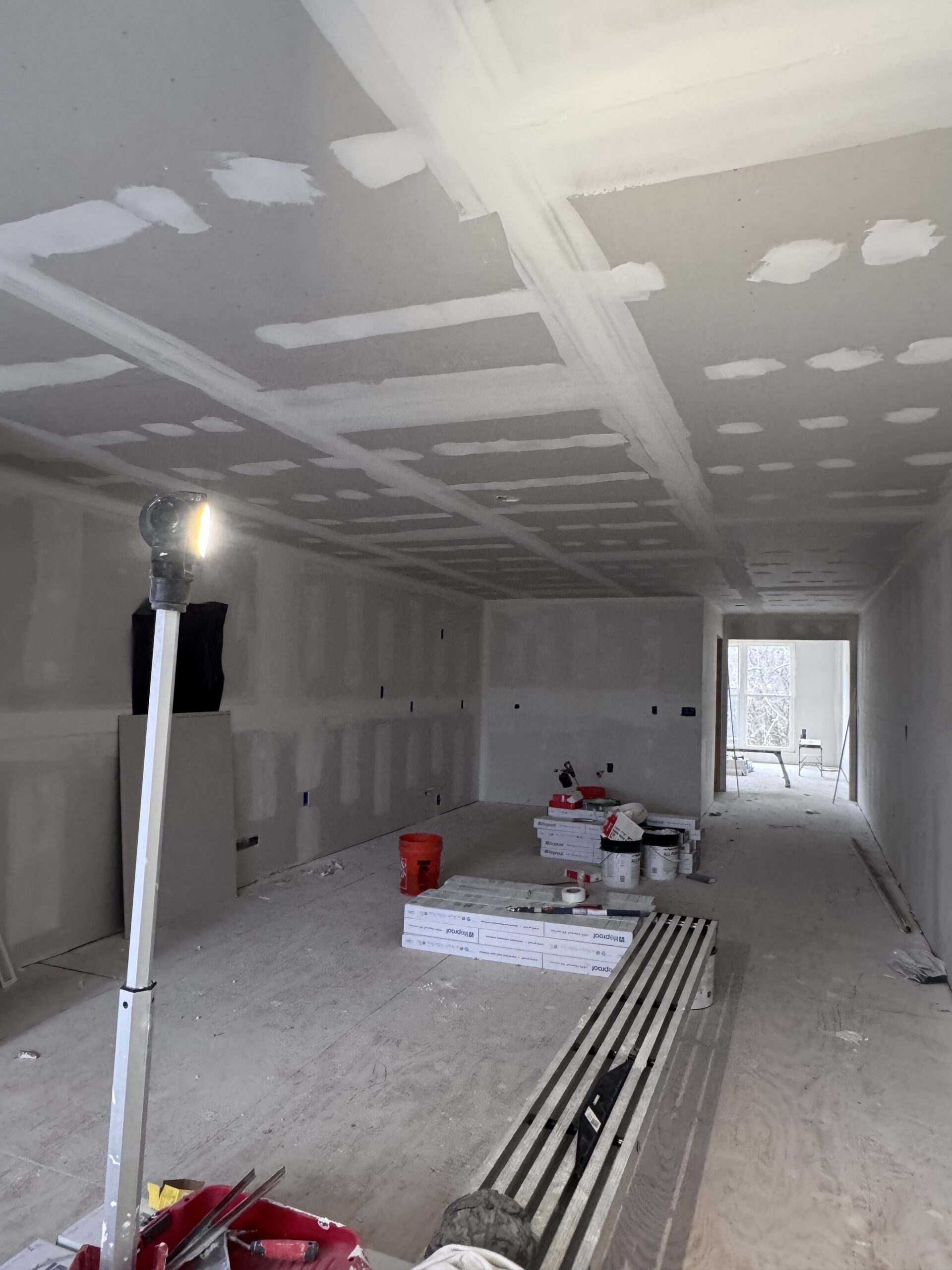 Bathroom tiling, grouting, and waterproofing progress for the Aurora property