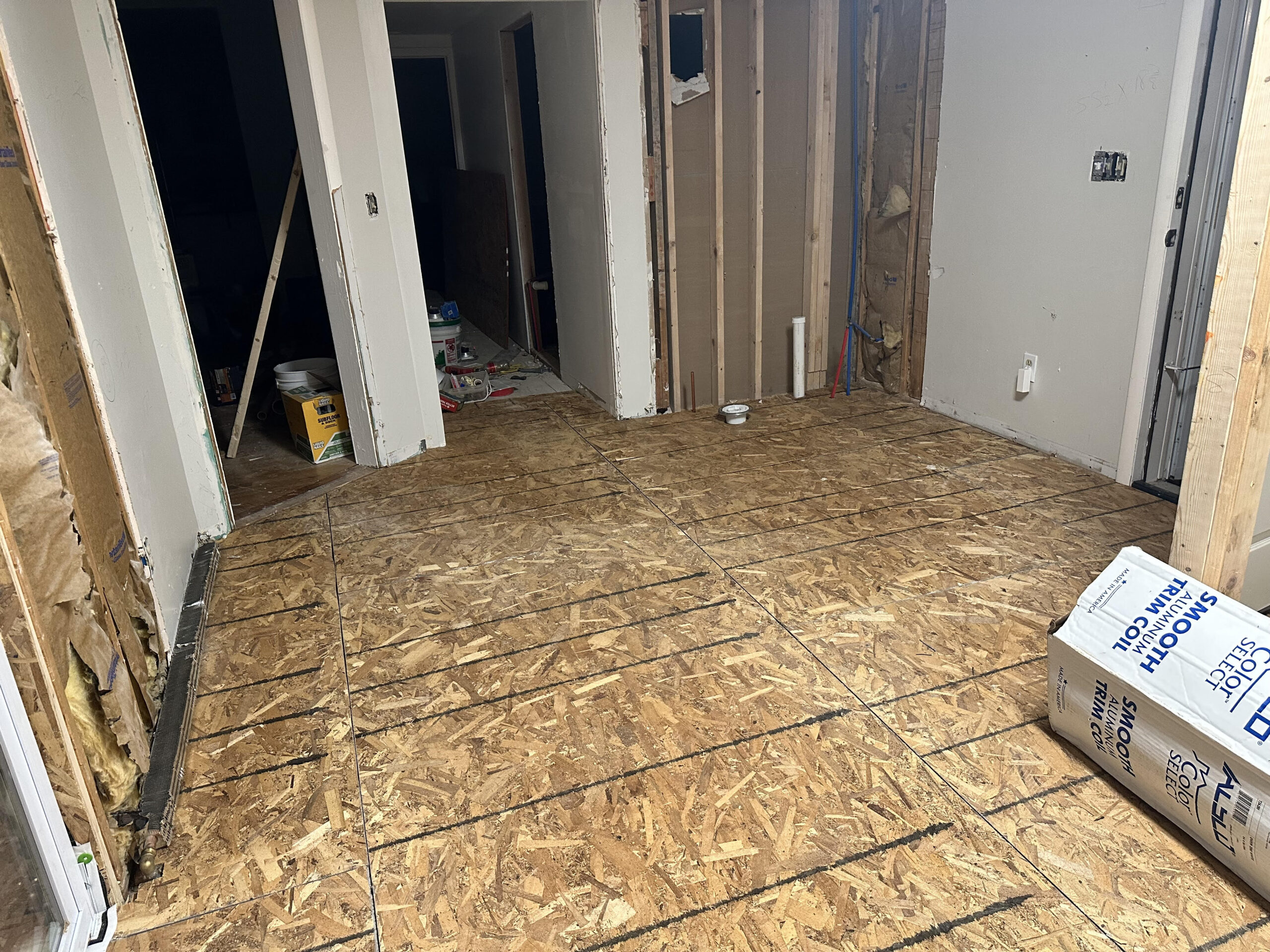 Drywall installation and room reconfiguration in the Finger Lakes property
