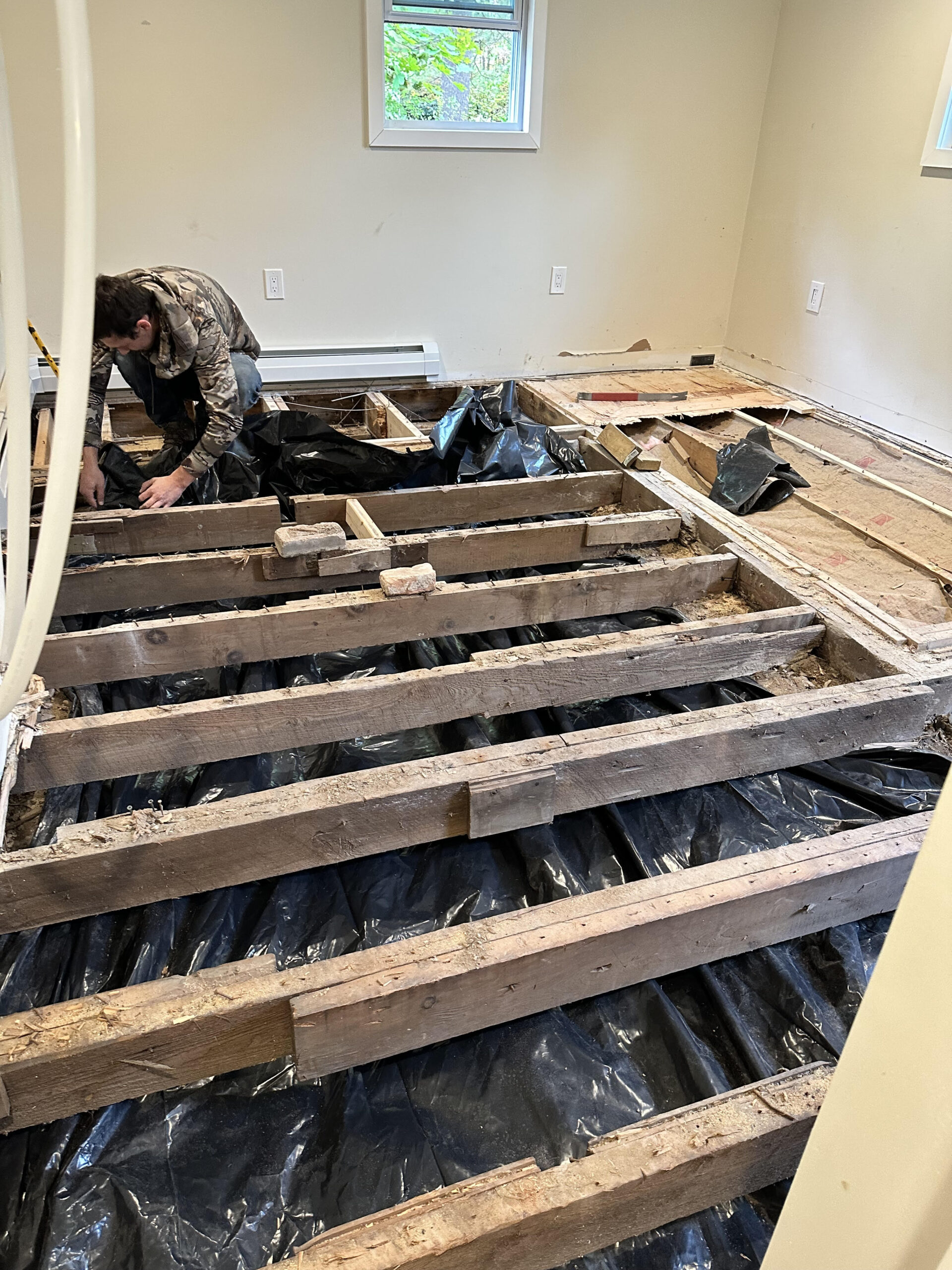 Exterior improvements and deck upgrades in progress overlooking the lake