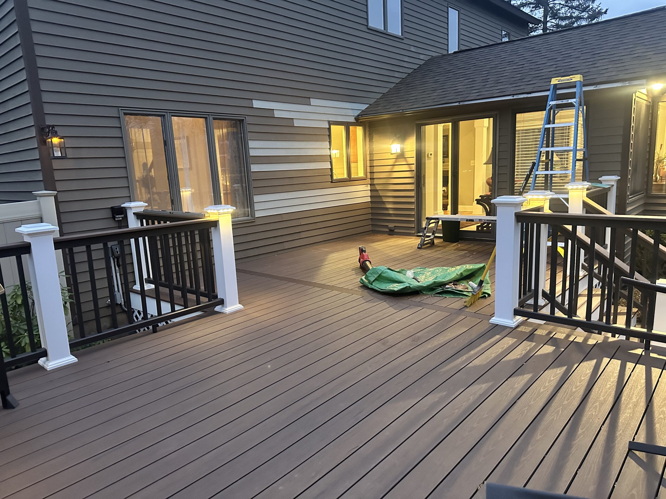 After photo of a custom low-maintenance outdoor living space featuring premium TimberTech decking