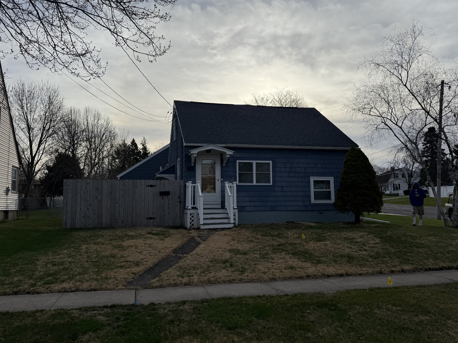 Before photo of a small, aging 3x5 wooden porch prior to WeBuild CNY's complete structural replacement