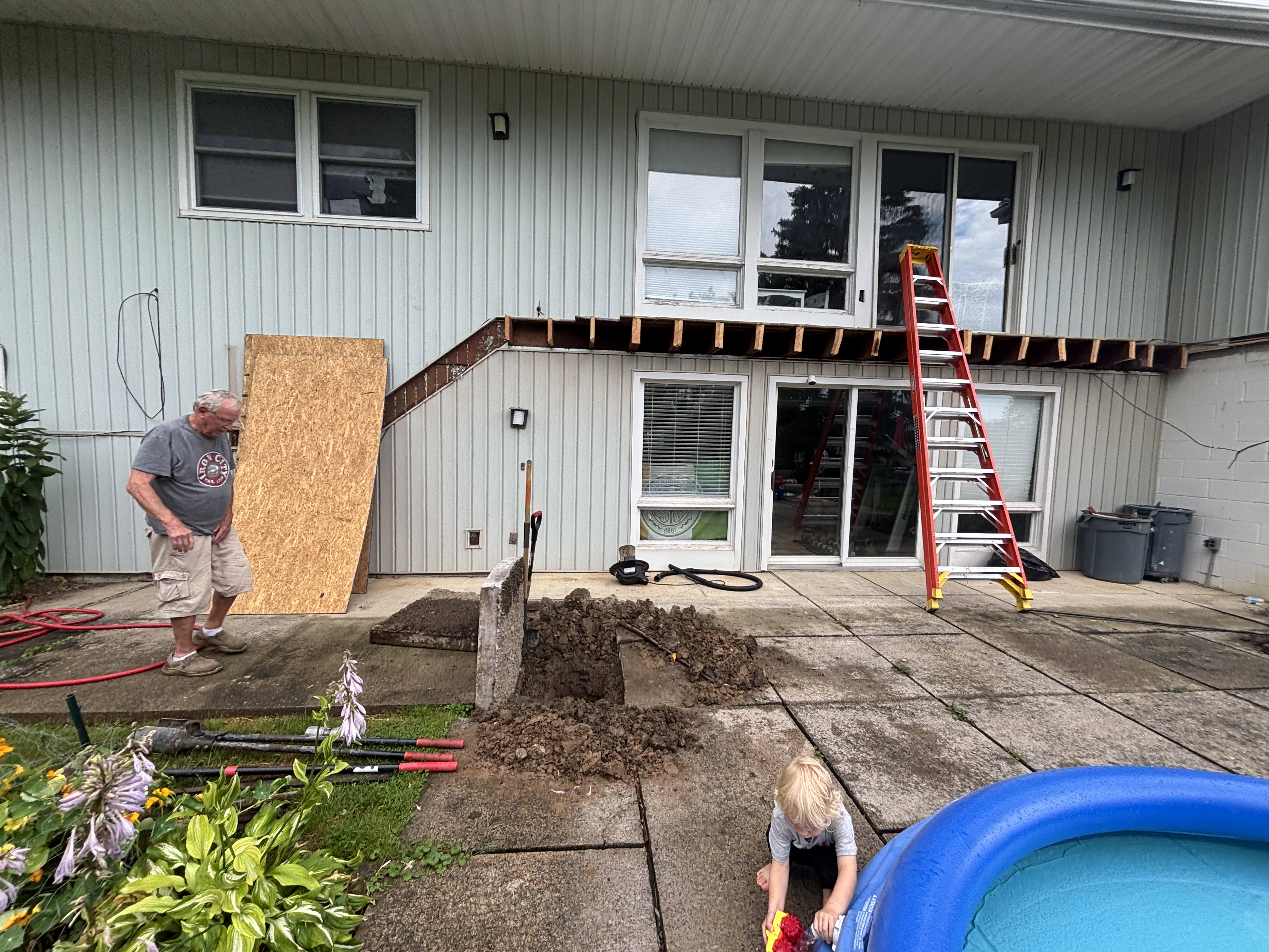 Before photo of an Owasco NY home exterior prior to custom deck construction
