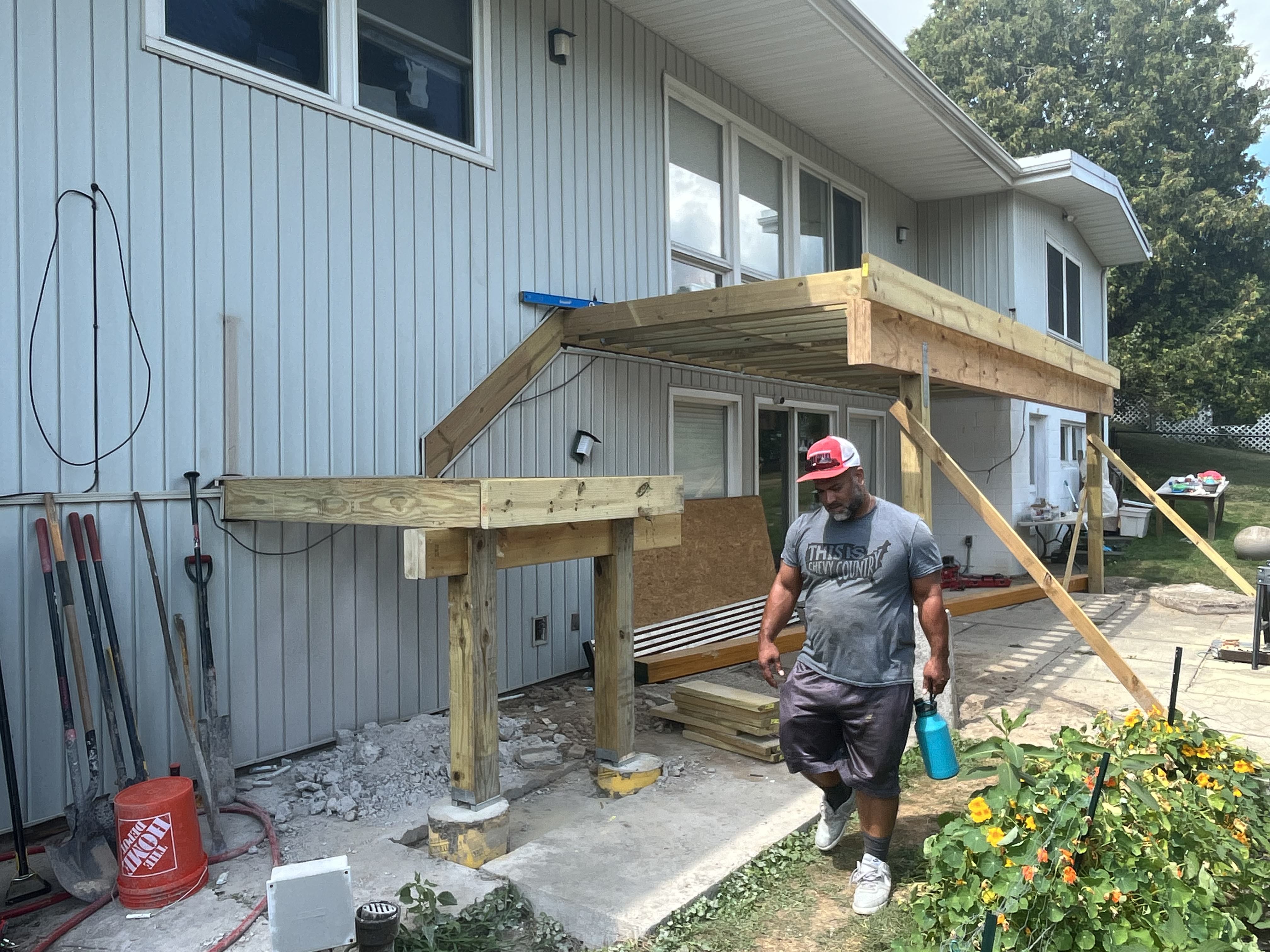 WeBuild CNY deck builders installing heavy-duty engineered wood beams for a massive 24-foot span