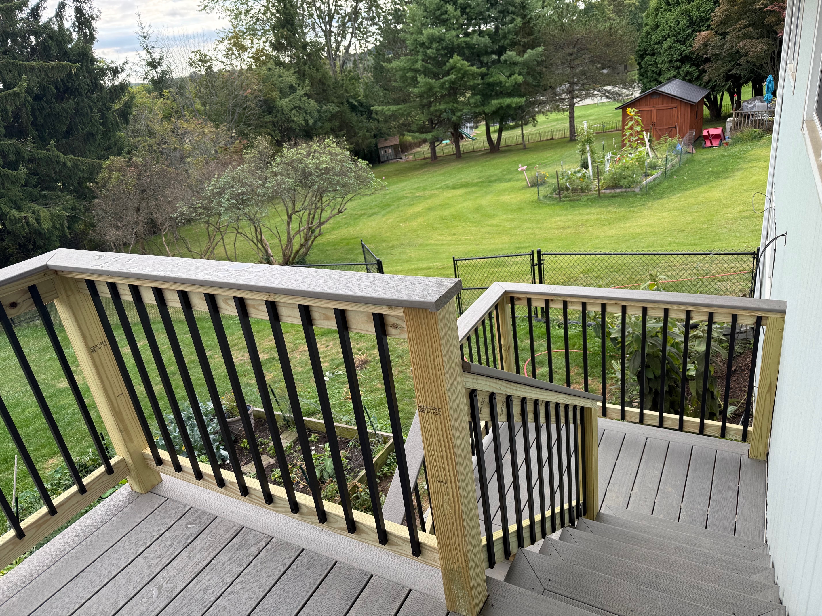 Custom elevated composite deck built by WeBuild CNY contractors in Cayuga County