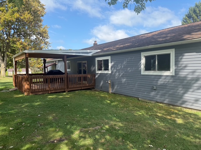 New construction vinyl windows and faux stone accents installed on a Cayuga County home