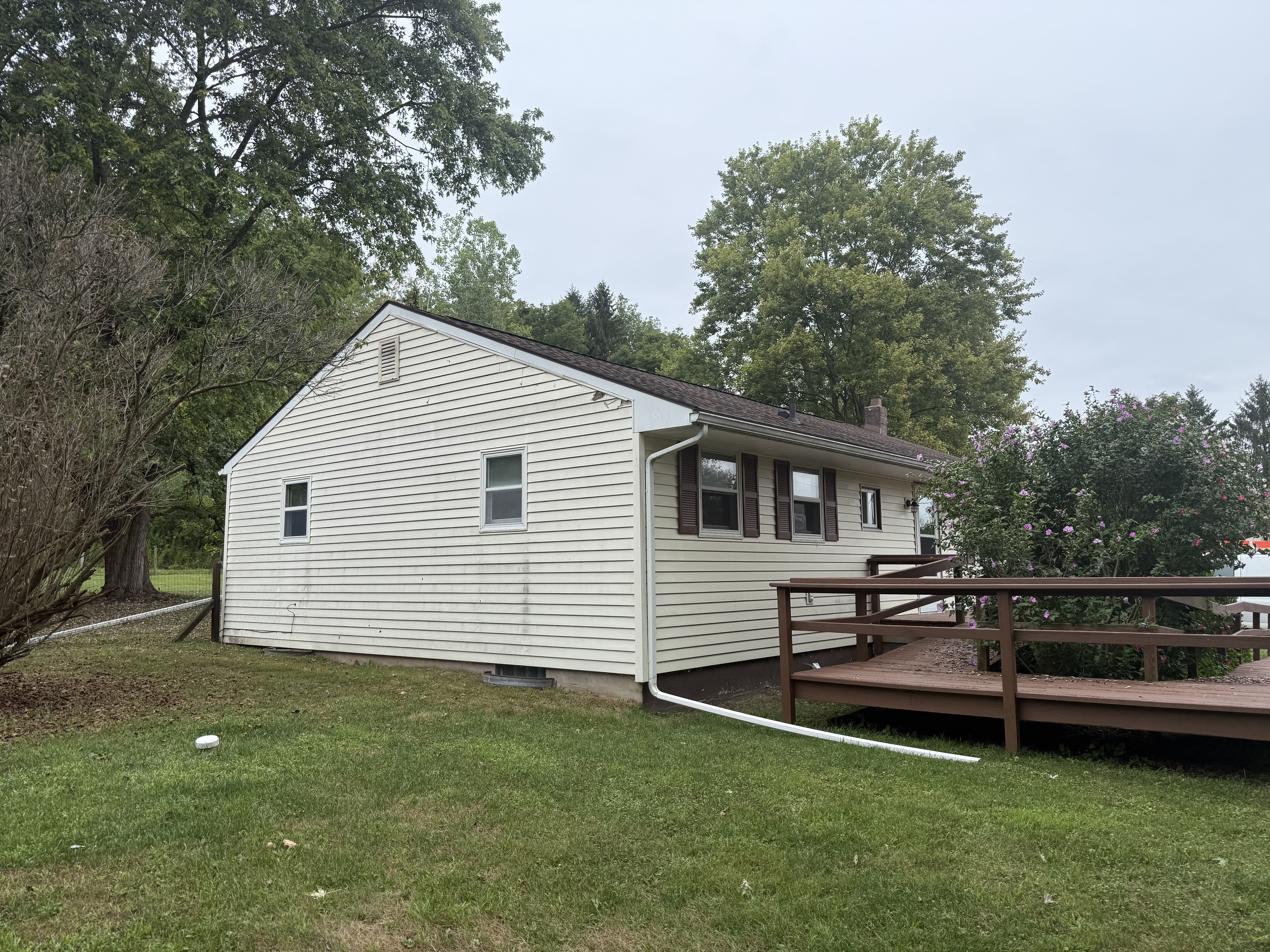 Rear of the house before the custom covered porch addition and exterior upgrades