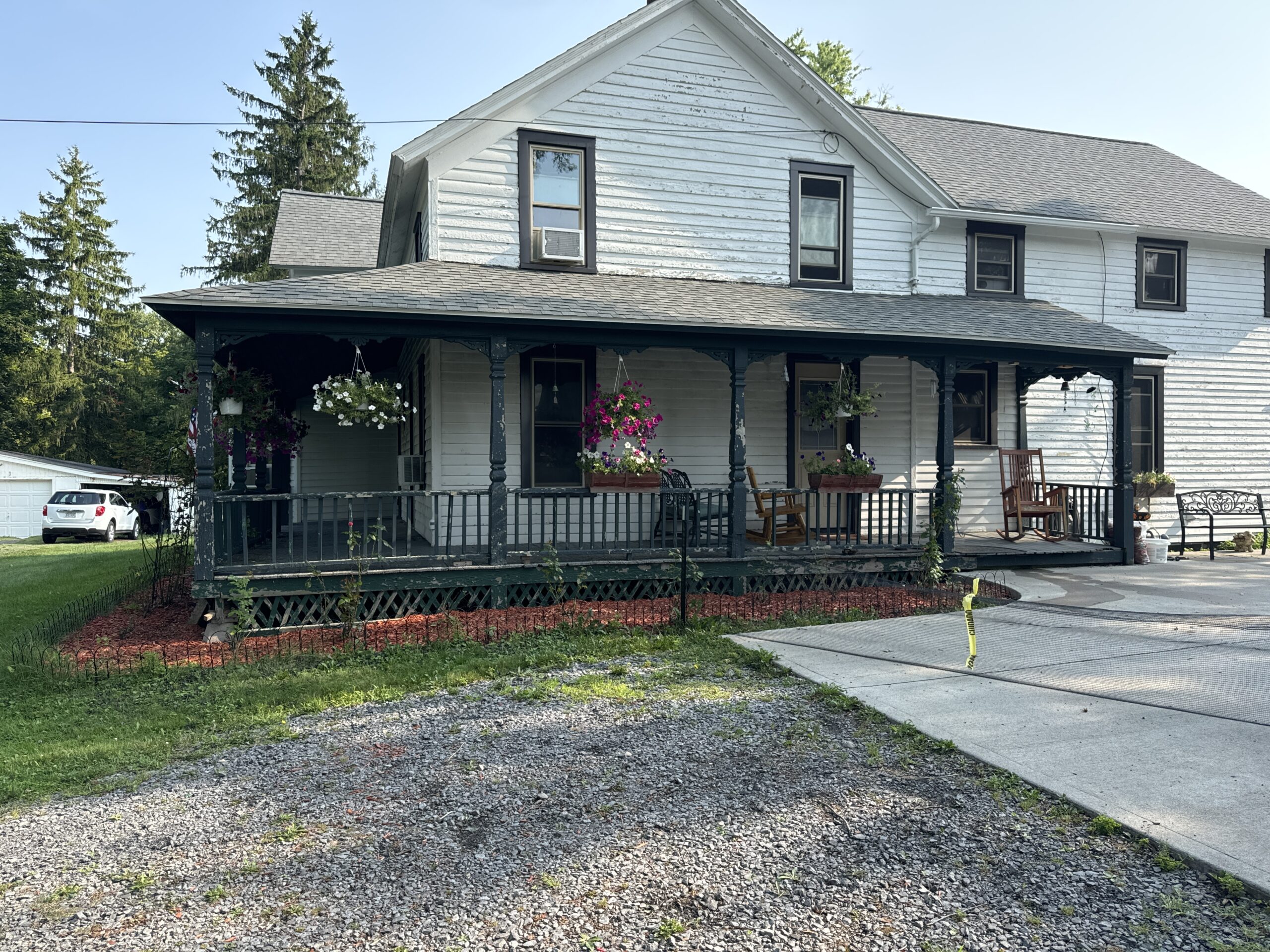 Deteriorating wrap-around porch structure requiring complete custom rebuilding in Fleming NY