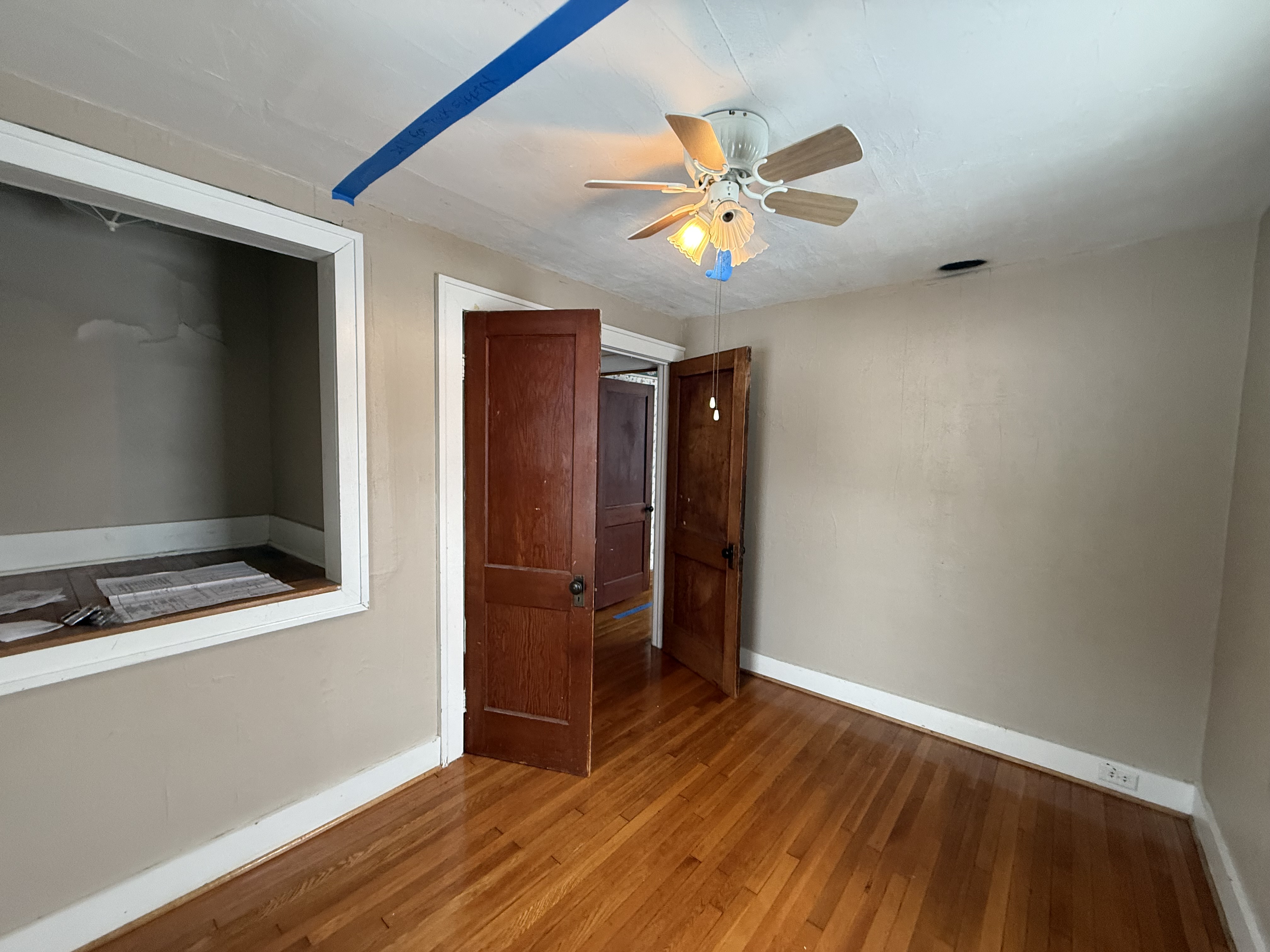 Original, outdated interior hallway in a Throop, NY residential home