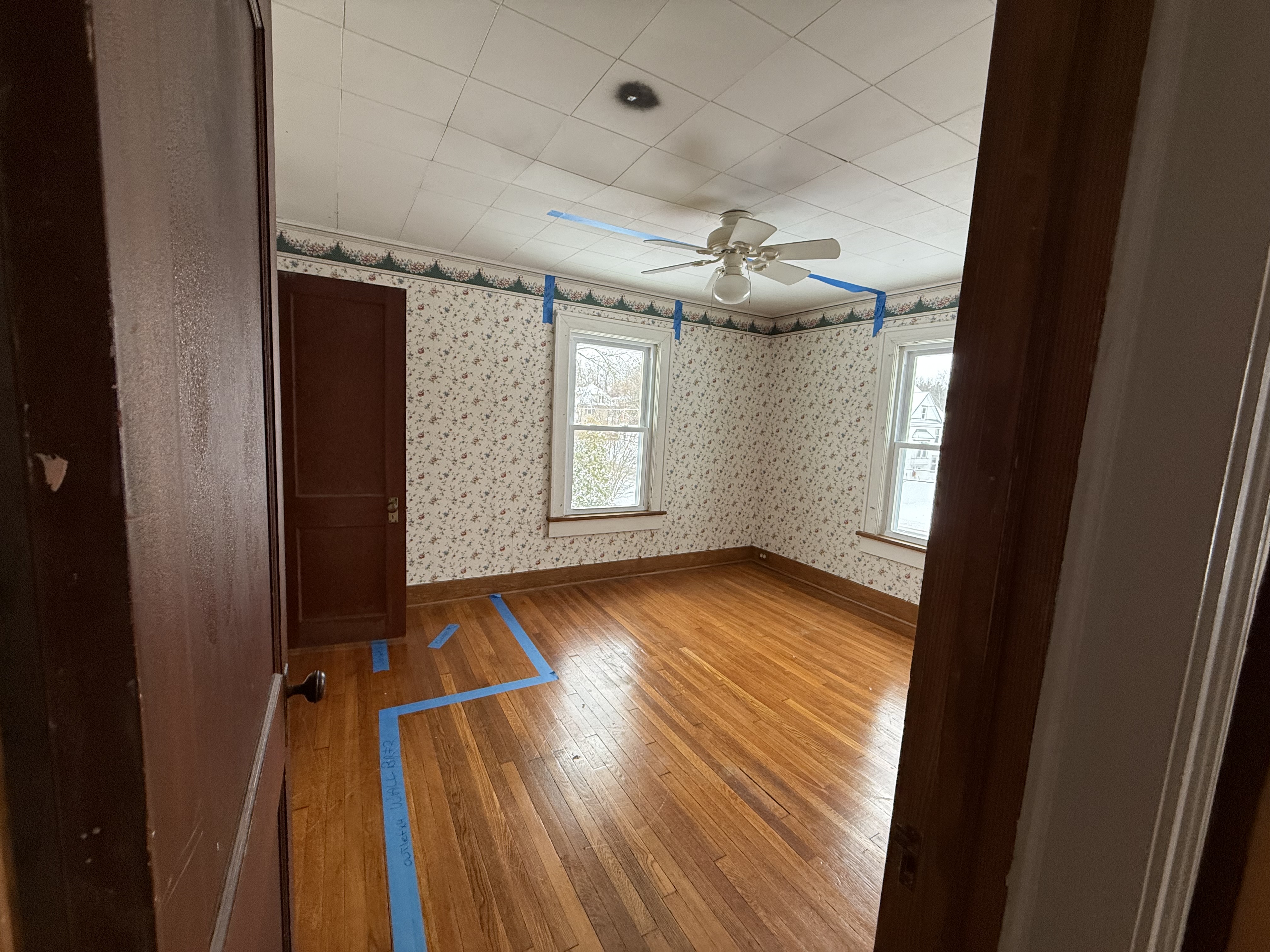 Steep, narrow, and unsafe original attic stairs requiring complete reconstruction