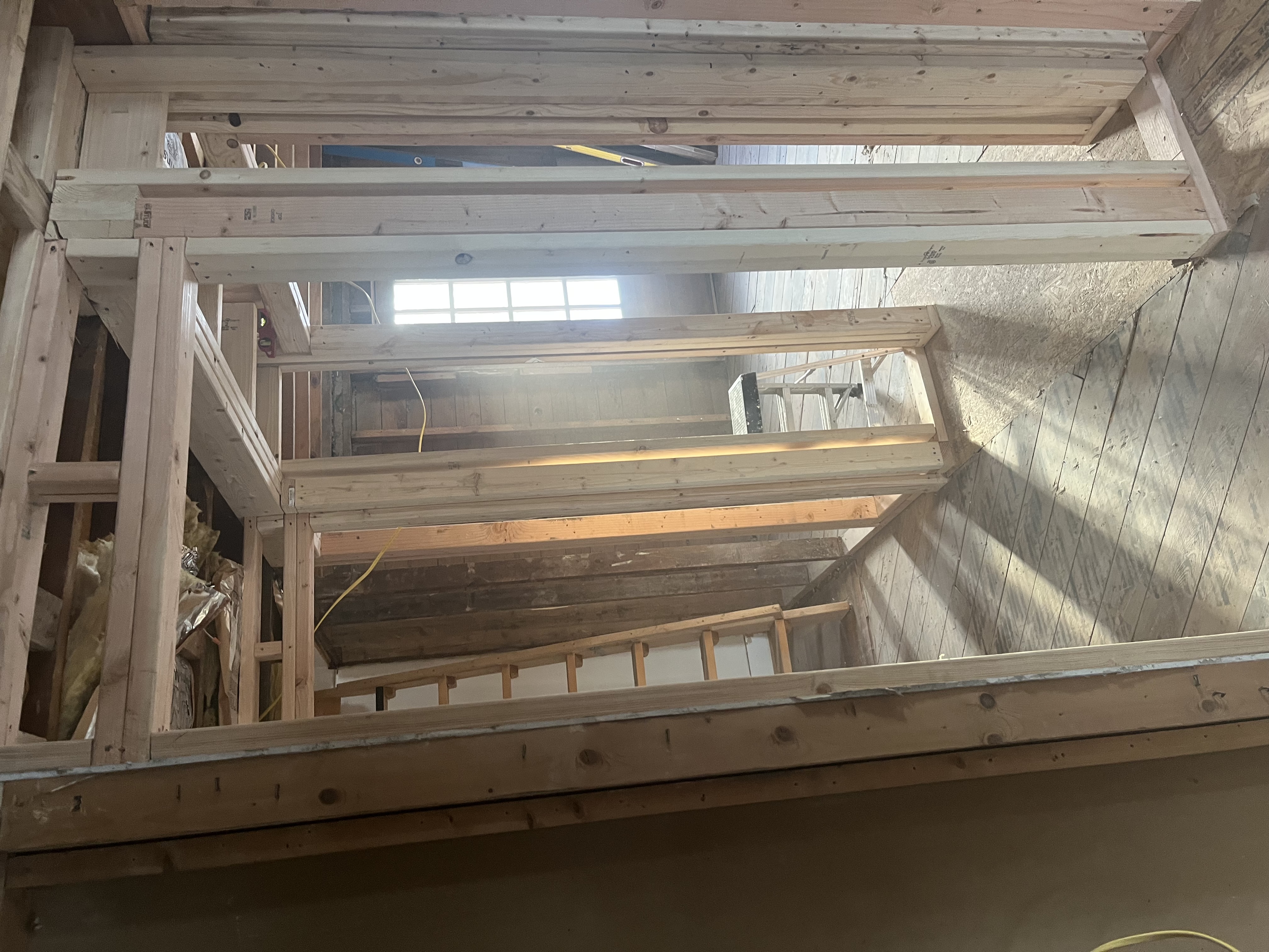Re-framing the 2nd floor layout to convert a 3-bedroom to a 2-bedroom space