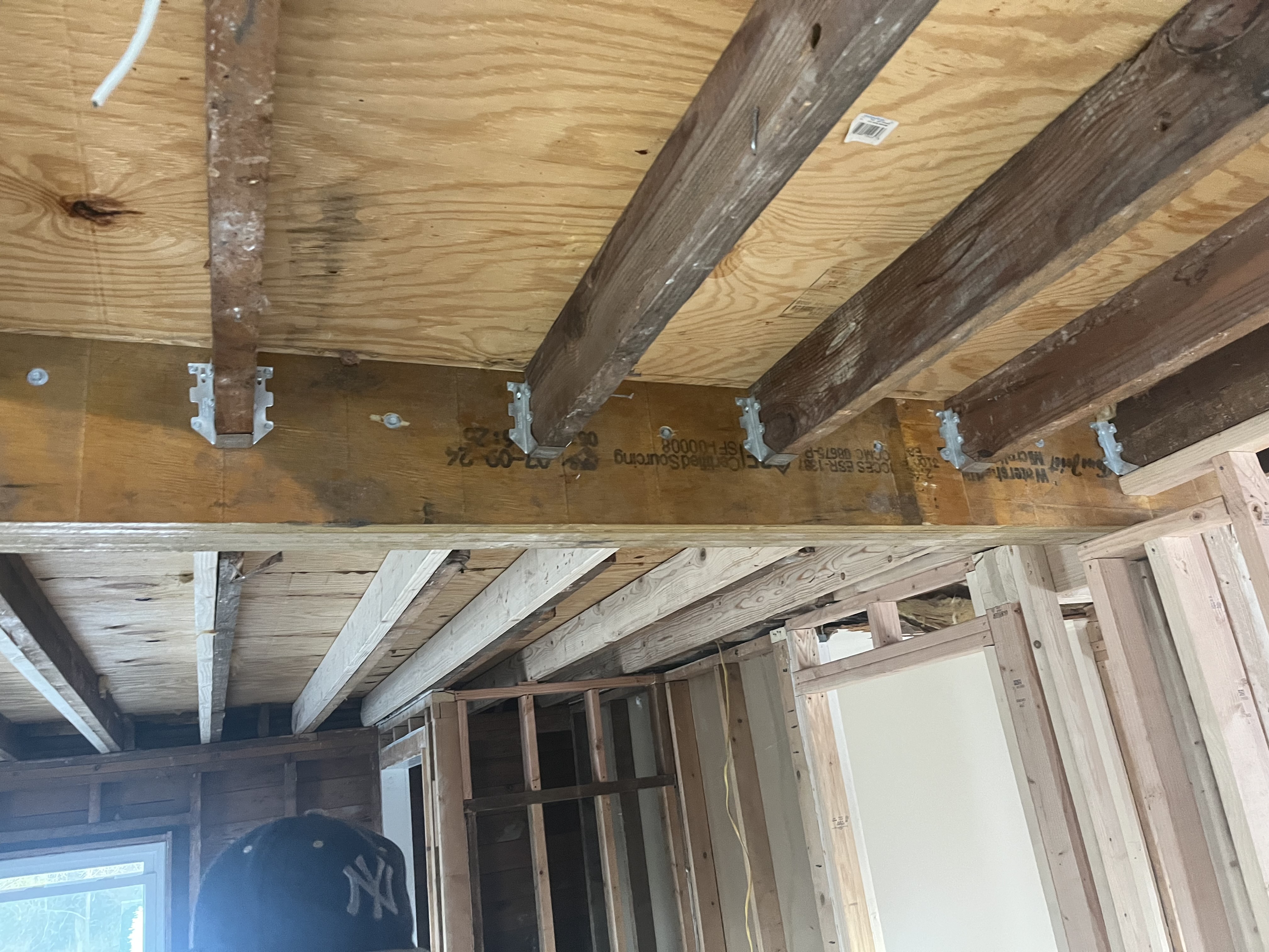 Demolition of steep, unsafe original attic stairs during a residential remodel