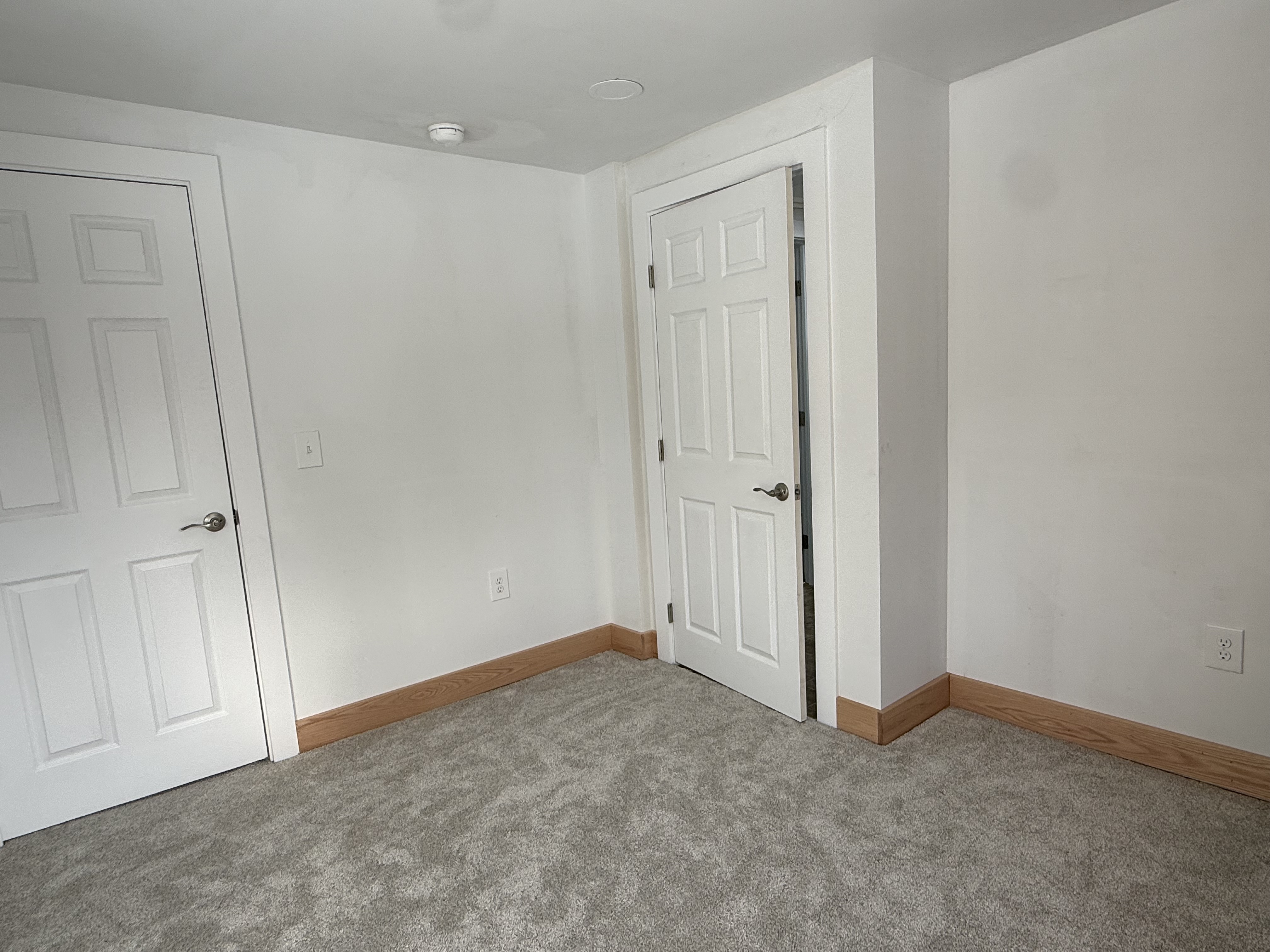 Completed interior home renovation showing flawless drywall and premium oak trim