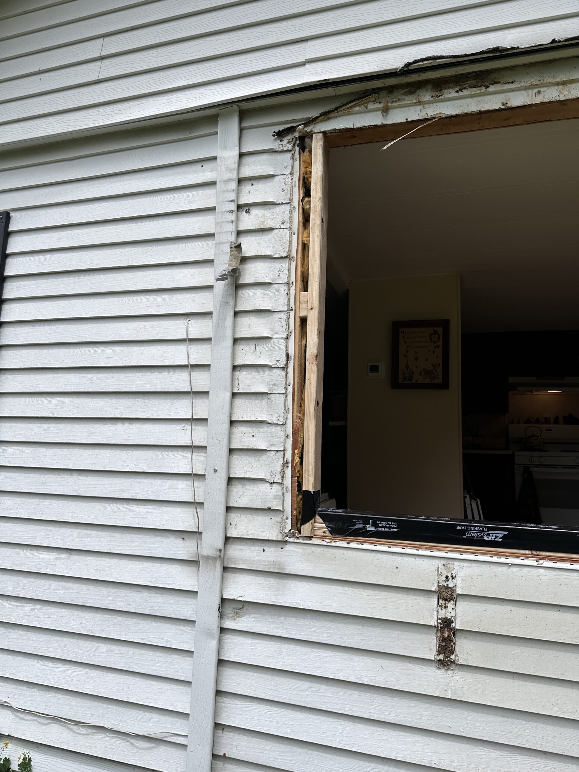 Original exterior home facade prior to WeBuild CNY energy-efficient window upgrades