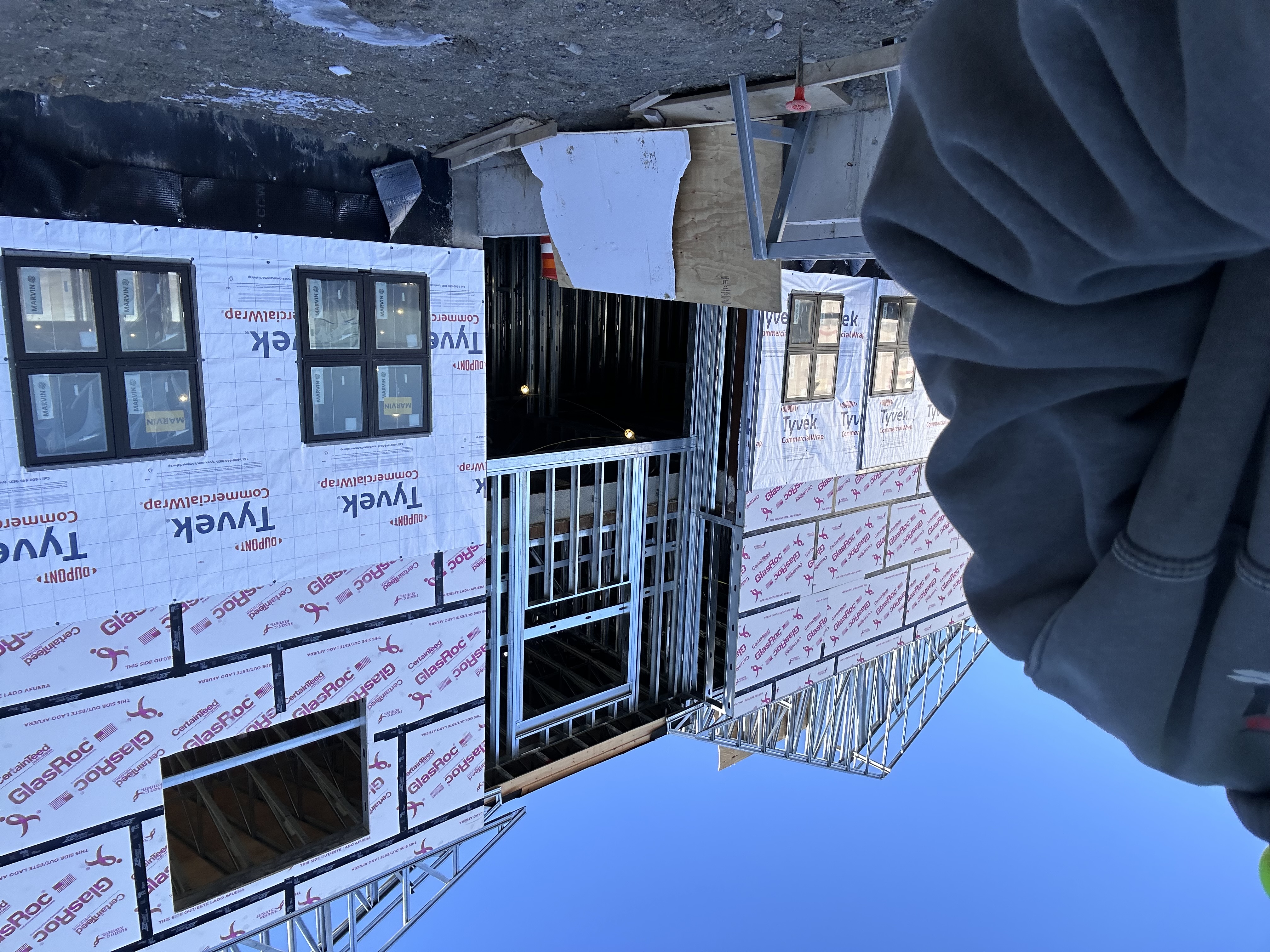 Condition of Skaneateles Lodge exterior before premium Marvin window installation